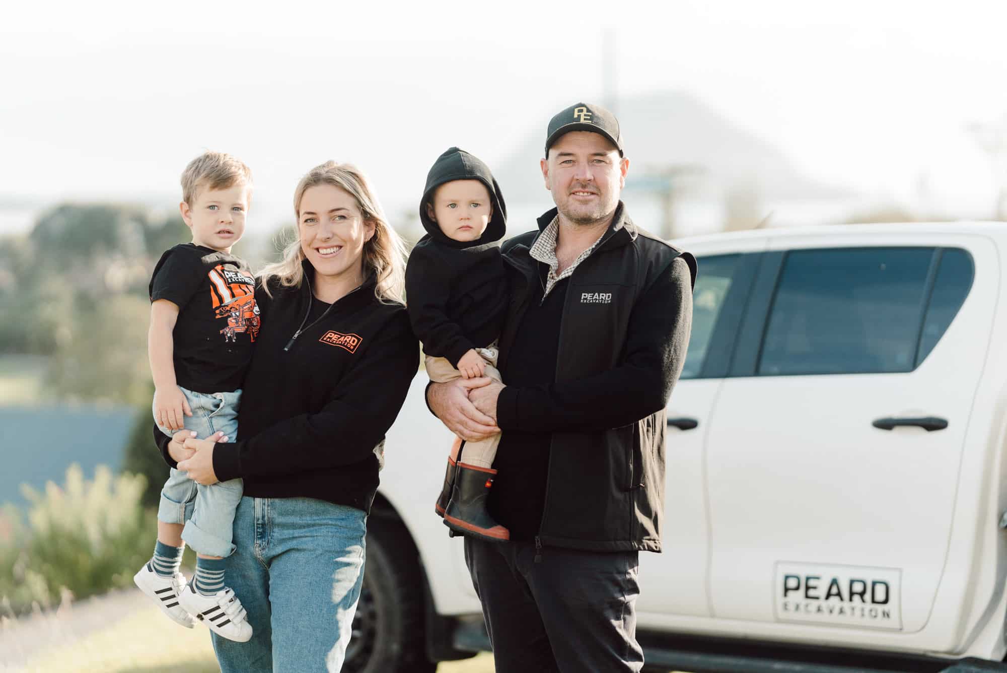 Toby and Holly Peard family beside Peard Excavation owner-operated truck Tauranga Bay of Plenty